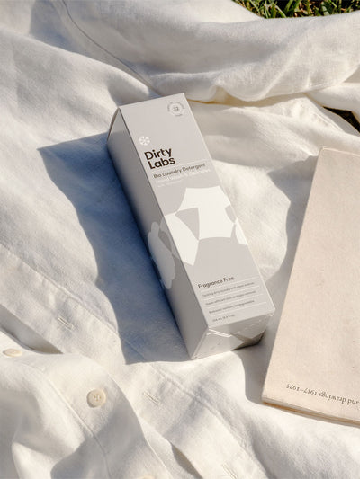 Dirty Labs Free and Clear box on white shirt with book