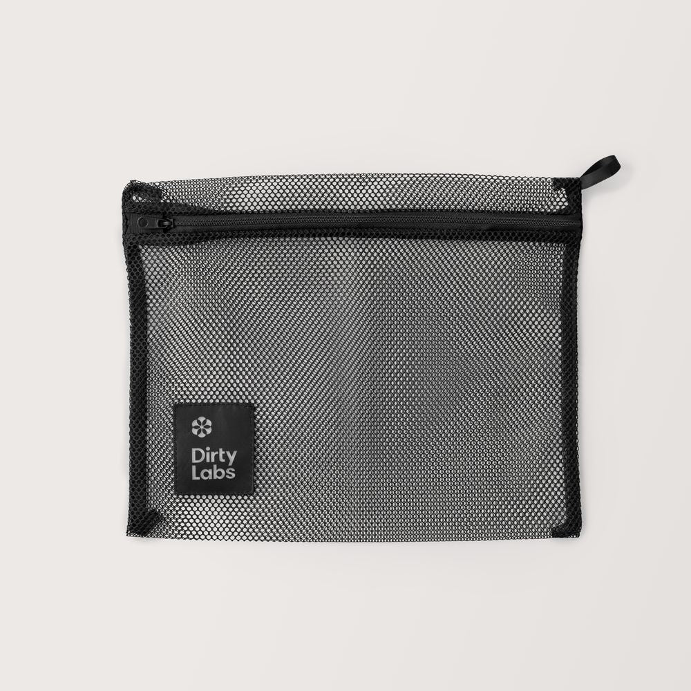 Black mesh bag with a visible brand logo on a light gray background